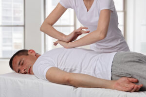 man on massage bed enjoying shiatsu massage